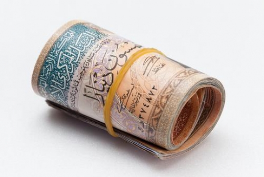 jordanian dinars rolled up