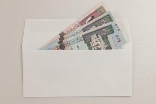 envelope with money isolated on white