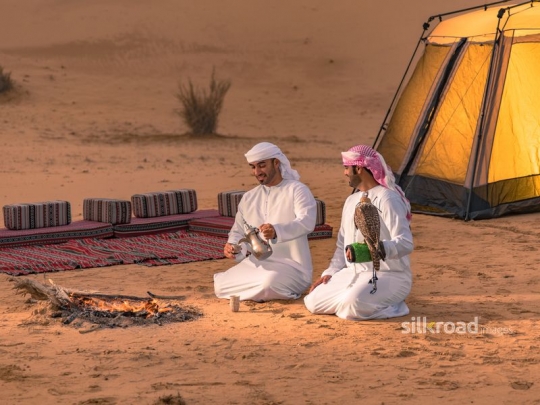 Man serving arabic coffee