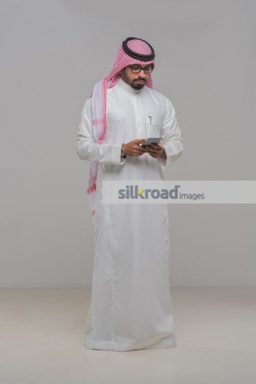Middle Eastern Businessman texting|