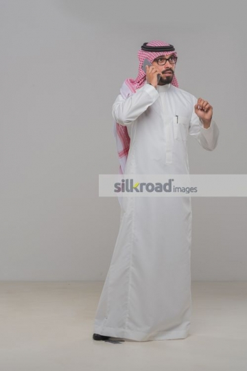 Middle Eastern Businessman having a serious conversation on the phone