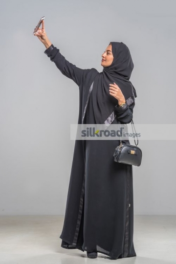 Arab woman taking a selfie |