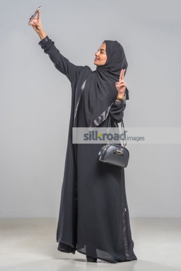 Middle Eastern woman taking a selfie 