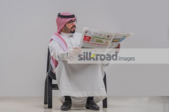 Businessman reading the newspaper