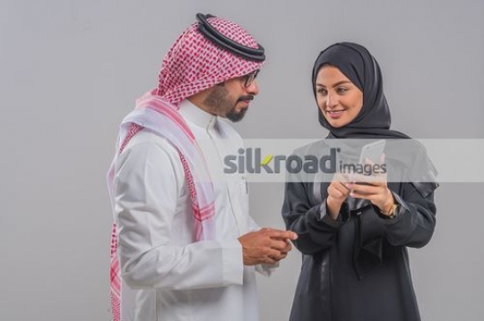 Arab man and Arab woman talking to each other