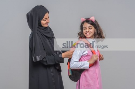 Mother fixing the girls bag