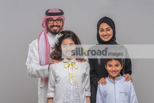 Middle Eastern family taking a photo together