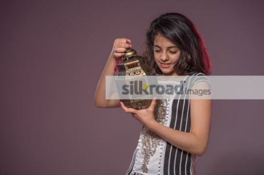 Young Middle Eastern Girl looking at the Ramadan Lantern
