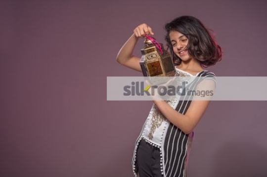 Young Arab girl carrying a Ramadan Lantern