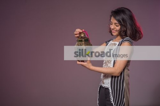 Young Middle Eastern girl carrying the Ramadan Lantern|
