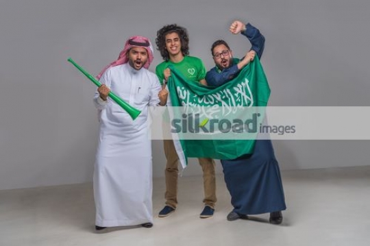 Middle Eastern men proudly celebrating their country|