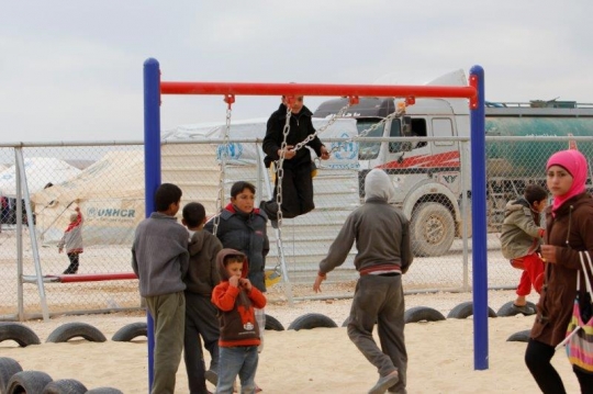 kids play with swing in a refugee camp