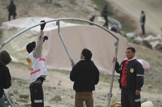 Palestinian demonstrators setting up tent at Bab al-Shams or Gate of the Sun
