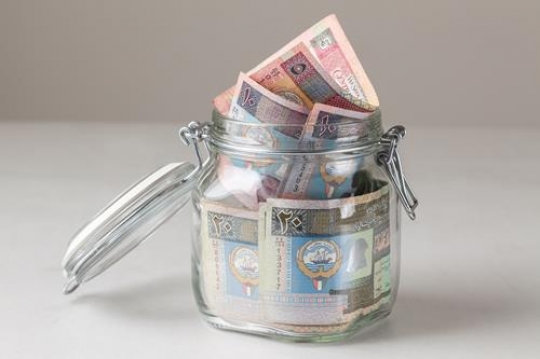 kuwaiti dinars in the glass jar