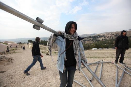 Female Palestinian Activist Building Tents Near Bab al-Shams