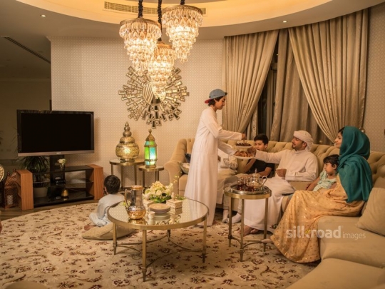 Family watching tv|-