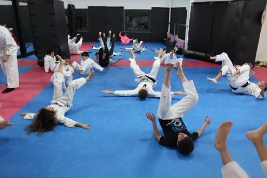 Children in a gym in martial arts training exercising karate, karate fighting Center