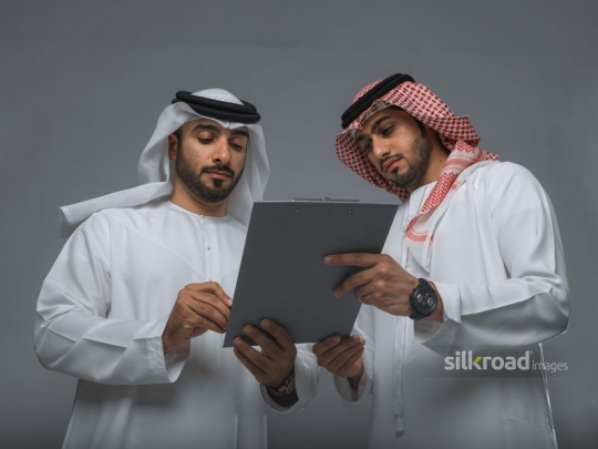 Colleagues discussing document