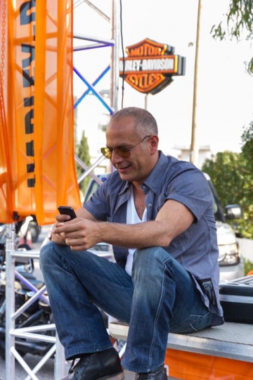 happy man holding and uses a mobile phone