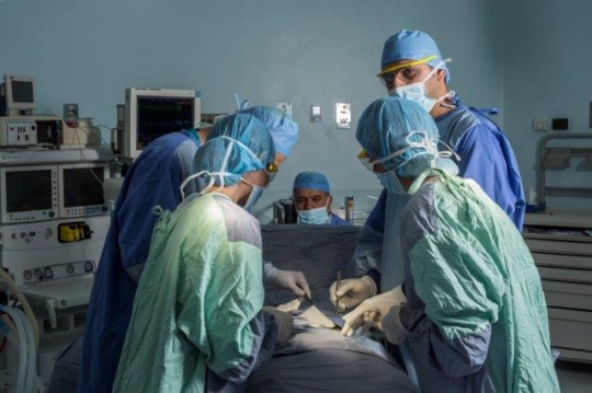 Surgeons Running an Operation
