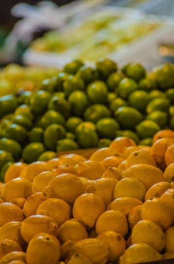 bunch of lemons in boxes in supermarket