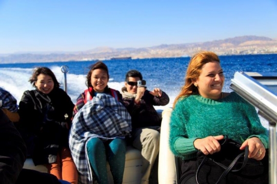 family enjoying the sea ride