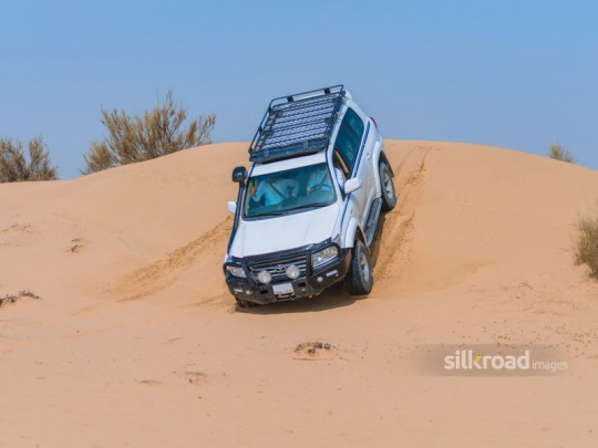 Big car descending the hill