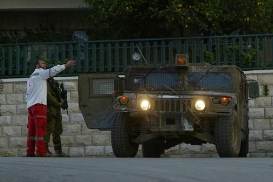 palestinian man talking with israeli soldier