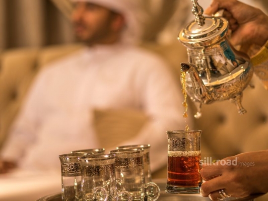 Wife serving Arabic tea|-