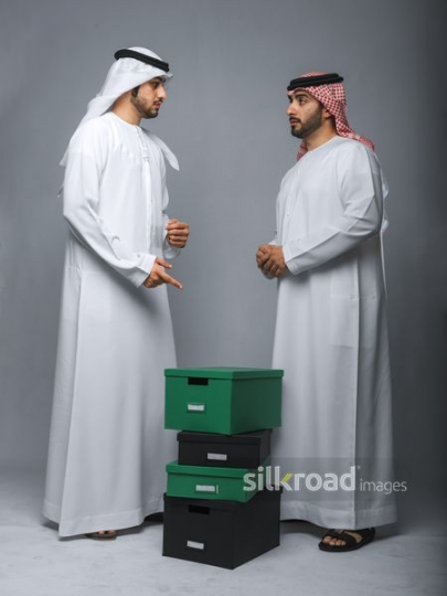 Colleagues moving boxes