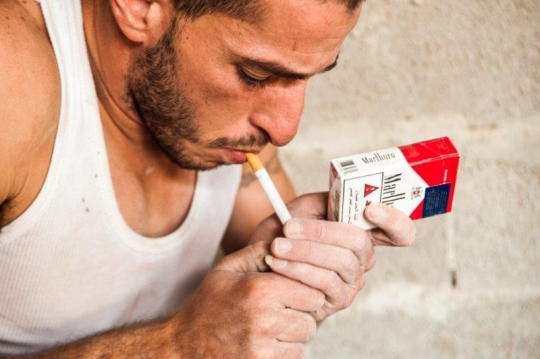 Palestinian Worker Smoking at Construction Site