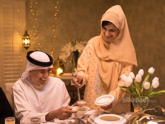 Mother serving grandfather soup|-