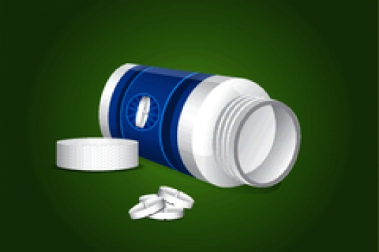 bottle for pills isolated on green background