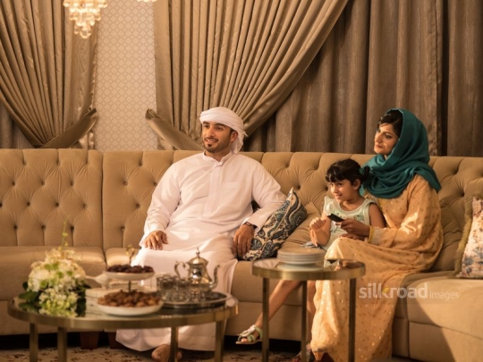 Family watching tv|-