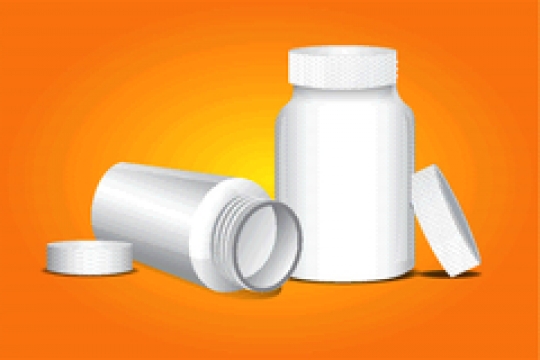 bottle for tablet on orange background