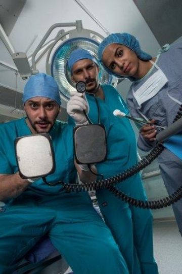 Surgeons Holding Electric Cardioversion and Surgical Tools
