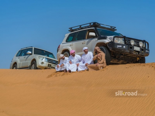Men taking a break in the desert