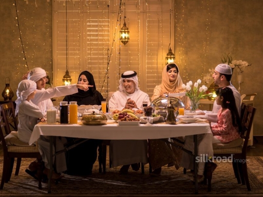 Family gathered around iftar|-
