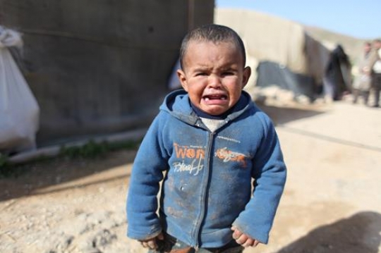 Sad little boy crying