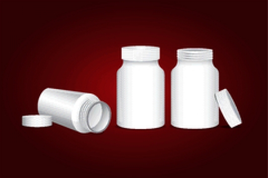 bottle for tablets on red background