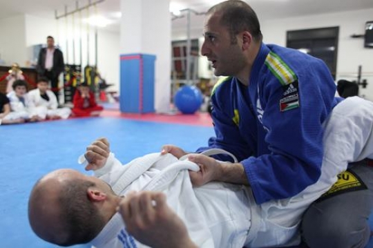 Children in a gym in martial arts training exercising karate, karate fighting Center
