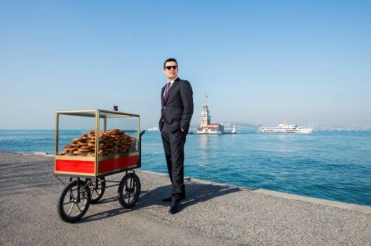 Turkish Businessman Selling Simit by Maiden's Tower Kiz Kulesi in Istanbul