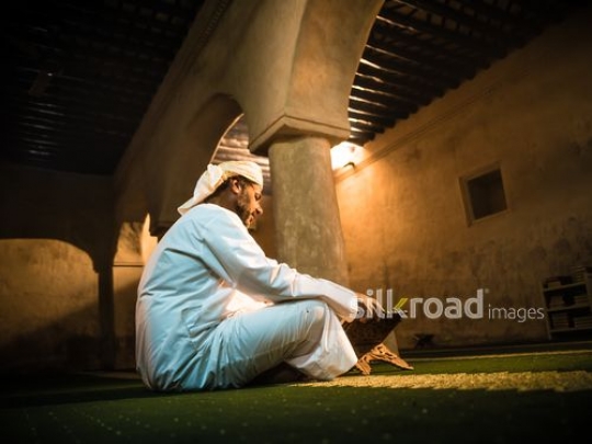 Old man reading qur'an at the mosque|-