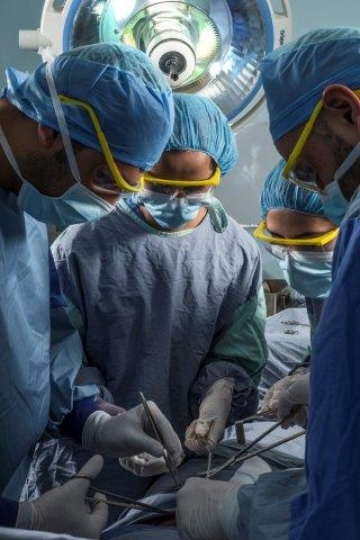 Surgeons Running an Operation