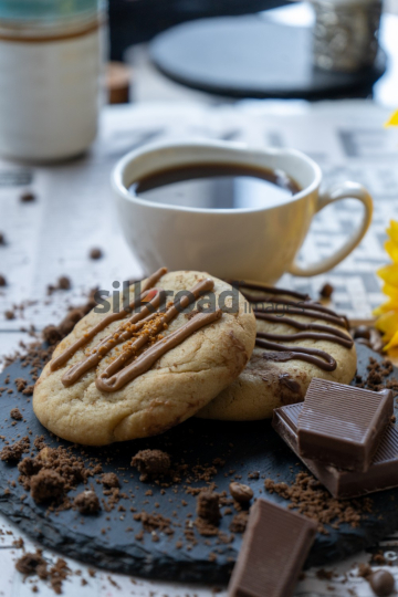 Freshly Baked Cookies with Chocolate Drizzle and Coffee
