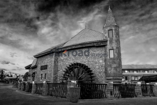Historic Stone Building with Water Wheel in Dubai