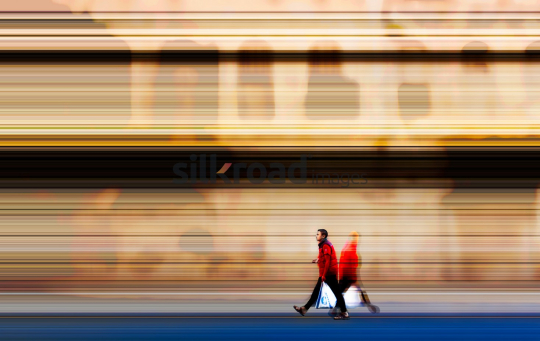 Man Walking in Al-Balad, Amman with Habbeba Sweet Bag - Fine Art Background
