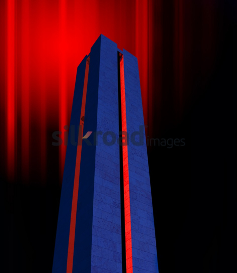 Modern Tower with Red Lighting on Blue Background