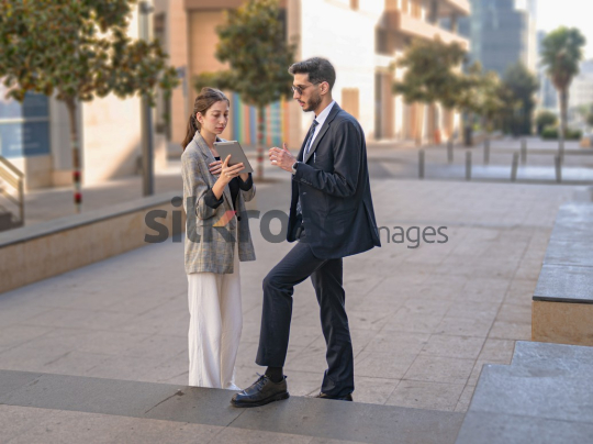 Professional Collaboration Between a Man and Woman at Al Abdali Boulevard