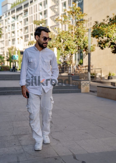 Professional Man Checking Time in Al Abdali Boulevard, Amman
